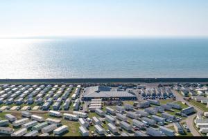 an aerial view of a parking lot next to the ocean at New Beaches: Butternut in Dymchurch