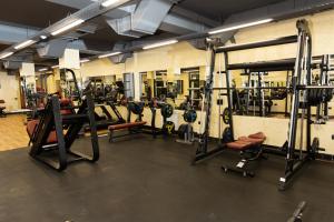 a gym with lots of equipment in a room at Leon Hotel Spa Ganja in Ganja