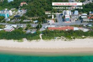 an aerial view of the beach and the ocean at YANBARU STAY ちゅら宿 in Nago