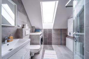Kúpeľňa v ubytovaní Apartamenty Eksploris II + 18 fotografií