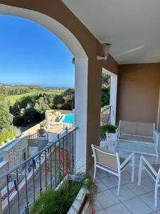 a patio with a table and chairs on a balcony at Chia Villas in Chia