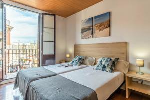 En eller flere senge i et værelse på AB Nou de la Rambla