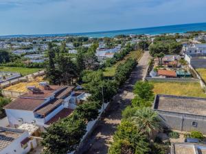 an aerial view of a city with the ocean at Residence Dolce Vita in Torre Lapillo