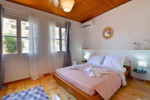 Postel nebo postele na pokoji v ubytování Welcome Inn Marlen's House