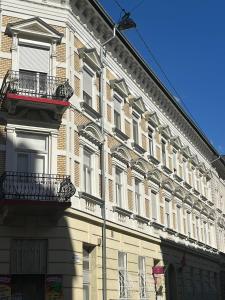 a large building with balconies on the side of it at Budapest Central Andrassy Apartment in Budapest