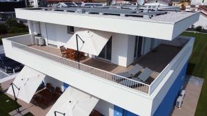 an aerial view of a white building with a balcony at RESIDENCE BLUMAR 2 in Lido di Jesolo