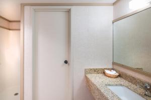 a bathroom with a sink and a mirror at Mountainside Inn 201 by Alpine Lodging Telluride in Telluride
