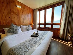 Postel nebo postele na pokoji v ubytování Cilantro Unwind Delisso Abode + 37 fotografií