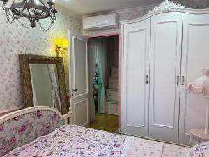 a bedroom with a bed and a mirror at Princess Vinhomes Smart City Apartment in Hanoi