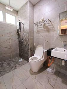 a bathroom with a toilet and a sink at Johor Bahru Luxury Pinnacle Tower 3 Bed 2 Bath in Johor Bahru