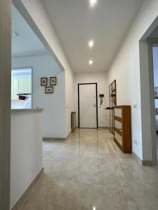 a room with a hallway with a door and a bedroom at Il Blu di Laveno in Laveno