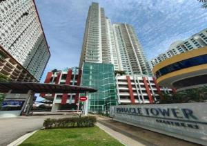a group of tall buildings in a city at Johor Bahru Luxury Pinnacle Tower 3 Bed 2 Bath in Johor Bahru