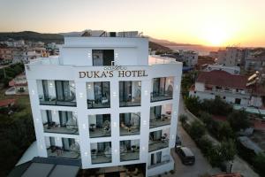 a building with a sign that reads duchess hotel at Duka's Hotel in Ksamil