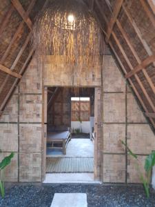 a room in a wooden building with a doorway at Apache surf villa in San Isidro