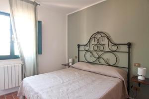 מיטה או מיטות בחדר ב-Agriturismo Terenzana