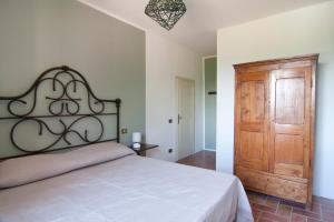 מיטה או מיטות בחדר ב-Agriturismo Terenzana