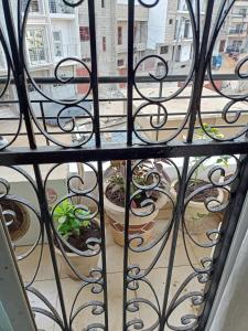 a view of a balcony through a wrought iron gate at Appartement 2 chambres Yoff Virage Dakar Senegal in Dakar