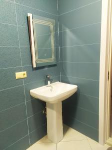 Vonios kambarys apgyvendinimo įstaigoje Family apartament