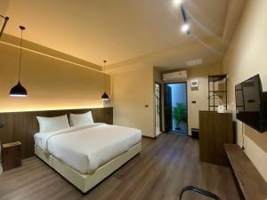 Voodi või voodid majutusasutuse Suncloud Hotel Koh Samet toas