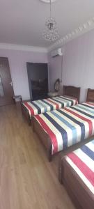 Een bed of bedden in een kamer bij MGguest house