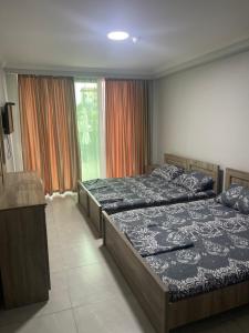 Postel nebo postele na pokoji v ubytování Hotel Mia