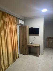 TV a/nebo společenská místnost v ubytování Hotel Mia