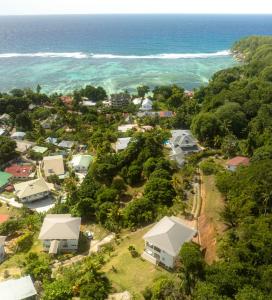 an aerial view of a small town next to the ocean at The Songbird Villa in Pointe Au Sel 