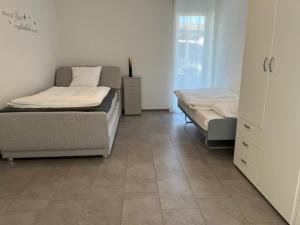Postel nebo postele na pokoji v ubytování Hotel Hippel Krone