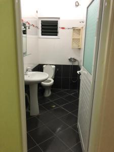 a bathroom with a toilet and a sink at STEFAN VASILI in Sarandë