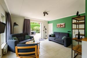 Posezení v ubytování LUXE vakantiehuis voor 6P voorzien van alle gemakken @Veluwe