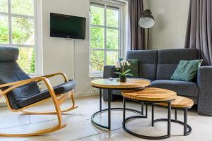 Posezení v ubytování LUXE vakantiehuis voor 6P voorzien van alle gemakken @Veluwe