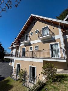 a building with balconies on the side of it at Ti Voglio Bene in Campos do Jordão