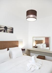 Кровать или кровати в номере Excelsior Apartaments Mamaia Nord