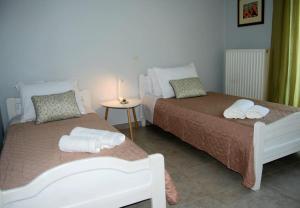 Postel nebo postele na pokoji v ubytování Luna Apartment, Rafina