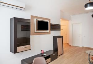 Телевизор и/или развлекательный центр в Excelsior Apartaments Mamaia Nord