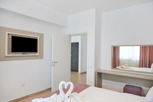 Телевизор и/или развлекательный центр в Excelsior Apartaments Mamaia Nord