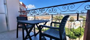 a table and chairs on a balcony with a view at Estudio Jávea Park Arenal in Jávea