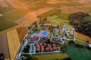 an aerial view of a mansion in a field at Hiška Amoris K117 Terme Banovci, 2 kopalni karti gratis in Veržej