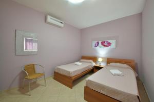 Postel nebo postele na pokoji v ubytování Gozo Spacious Apartment with Large Communal Pool