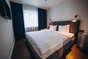 Letto o letti in una camera di Avalon Hotel&Pool