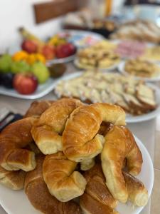 a plate of croissants and other pastries on a table at Hotel Arenas Blancas in Federación