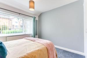 Delightful Garforth Home客房内的一张或多张床位