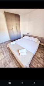 Postel nebo postele na pokoji v ubytování Apartmani Vuković