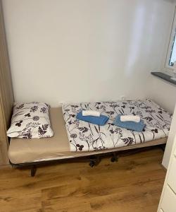 a bed in a room with two pillows on it at Apartma Lavanda in Koper