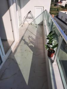 a shadow of a person walking down a balcony at Alanya-Avsallar 55m 1+1 in Avsallar
