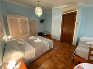 Postel nebo postele na pokoji v ubytování B&B La Pitraia