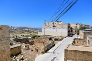 a view of an old town from a building at Azure W B&B in San Lawrenz
