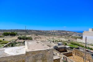 a view of the city from the roof of a building at Azure W B&B in San Lawrenz