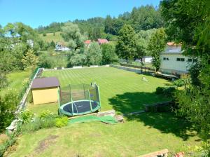 an aerial view of a large yard with a trampoline at Penzión Antiqua Villa in Spišská Stará Ves