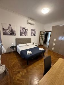 a bedroom with a bed with two towels on it at Civico 85 in Rome